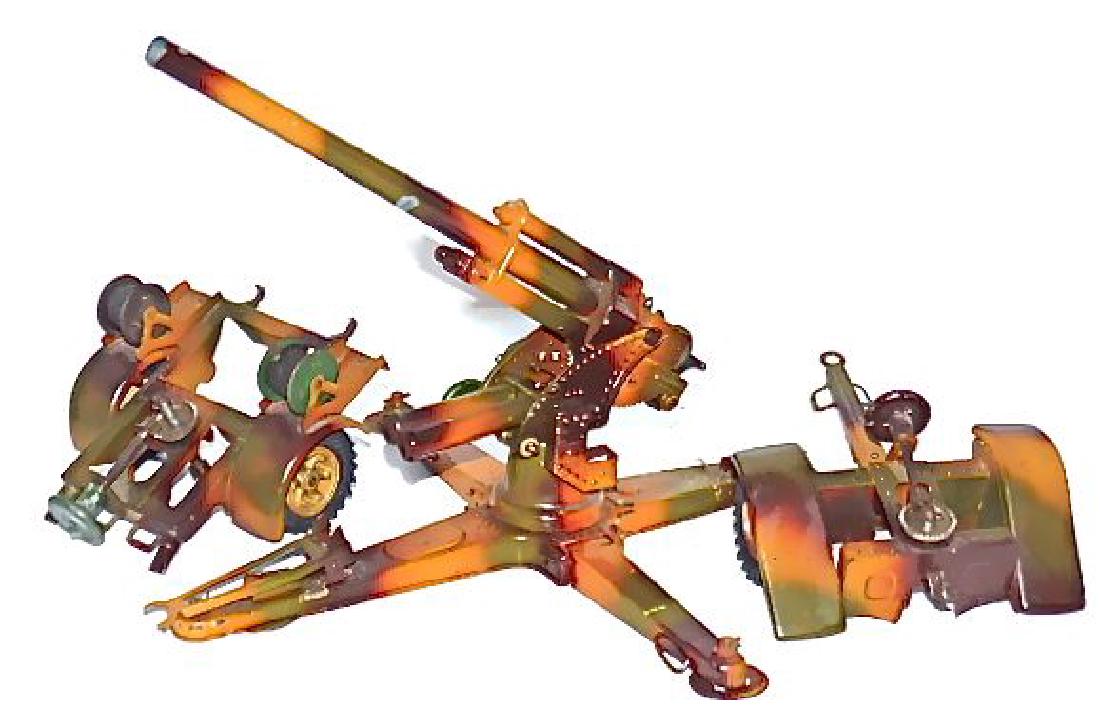 Lineol Camouflage 88 Cannon with 2 Caissons: Complete and all gears/ breech functional. Cocks and fires normally. Excellent paint quality with just a few scratches mostly under the barrel where it touches the brace. Cable rolls full with origina