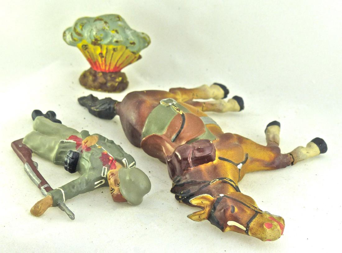 Lineol Dead Horse 1 Explosion 1 German Soldier: Dead soldier is a Reiner Krock figure that is like new. Small explosion with some light wear. The very scarce horse has some small, thin leg cracks with excellent paint quality. 3 Pieces. 7.5 cm. Kroc