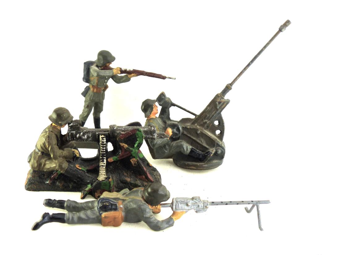 Lineol 3 Danish Soldiers Elastolin 1 Danish: Figures with few minor cracks and some light wear. 2 cm FLAK gun missing the base. Faces and paint still very good. 4 pieces. 7.5 cm. Made 1936-40. Good to very Good.