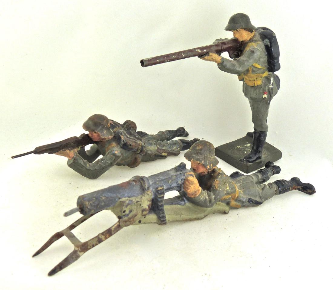 Lineol 3 Danish Combat Soldiers: Just couple of minor cracks with very good paint quality. Soldier with hollow barrel rifle that can shoot caps has had the back repaired and opening covered up. 3 pieces. 7.5 cm. Made from about 1934-