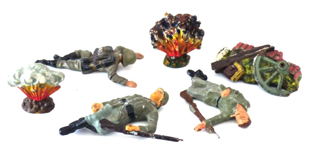 Lineol Rubble 3 Wounded Germans 2 Explosions: Rubble heap with some wear and good color. Both explosions ( 1 is Elastolin ) with excellent paint. Soldier on stomach very good. He's Swedish. Soldier on back with rifle is excellent. It's a Kienel p