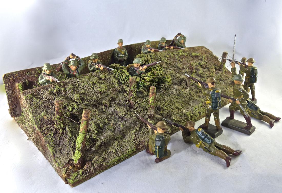 Lineol Trench 8 German and 6 US Soldiers All 6.5cm: The Lineol trench has all the posts and wires with very little wear. Designed with place for machine gun in center. Hardly any cracks or wear to figures. Mostly fighting molds with one German General.