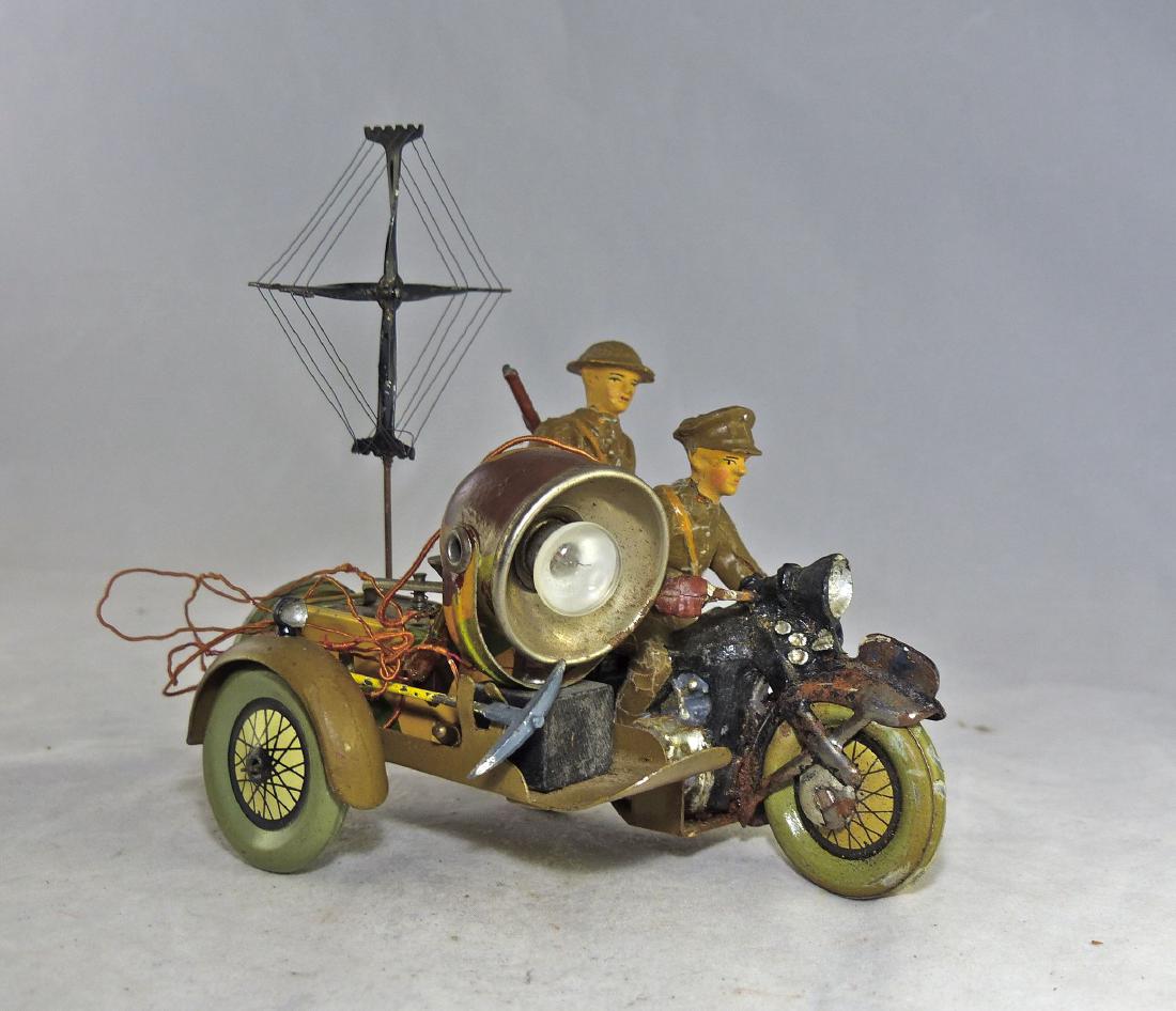 Hausser Scarce US Motorcycle with Light and Morse: Some wear to fenders and main wheels of cycle. Outside wheel, fenders and spare tire all excellent. Bulb in place, axe on side of morse box, antenna at rear and all wires present. Rifle tip from rider