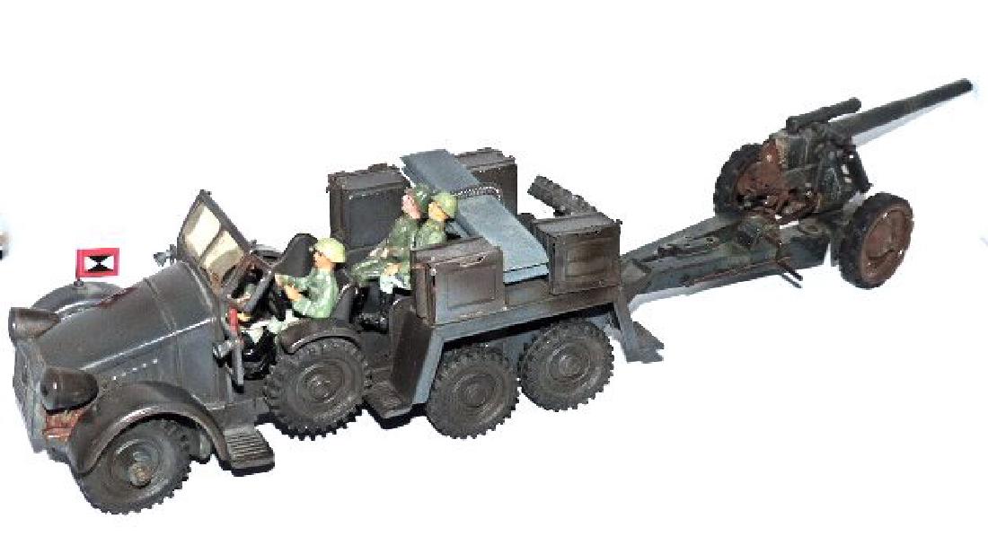 Hausser Protz Truck Towing Tippco Howitzer: Cannon with light wear and good lithographed color. Will not cock and fire. Crank mechanism to raise/ lower barrel works good. Rubber tires intact. Late version truck with no lights has excellent pain