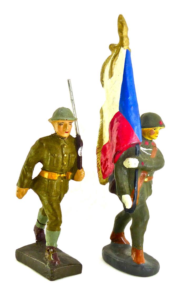 Lineol Elastolin Czech Soldiers 1 Flag: Soldier with flag has one minor crack and hardly any wear. However, it appears that part of the flag-white section-has been touched up. Both faces and paint quality are excellent. Czech with rifle is 