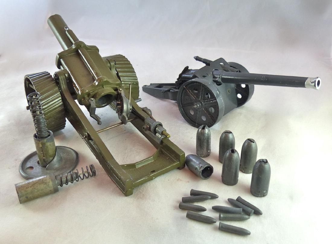 Britains 18 Inch Howitzer with Tractor Wheels: Howitzer Set #1266 and 4.7 Naval Gun Set #1264. Pre War. Both guns prewar. 18 inch heavy howitzer has almost no wear and all parts work normally. Comes with a base, two loaders and 6 large metal shell
