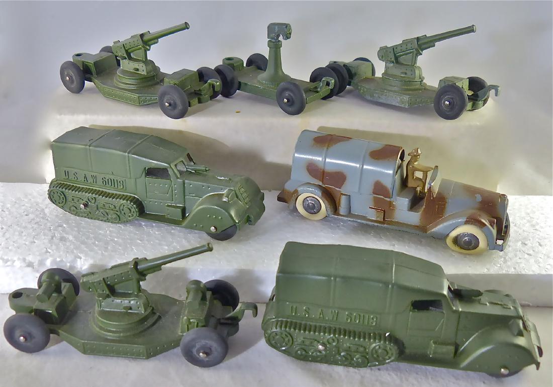 Tootsie Toy Military Pre War: All 7 pieces have rubber wheels. Camo truck not marked Tootsie but Made in USA. AA guns and half-tracks with hardly any wear and complete. Other 4-wheel missing. 7 Pieces. Overall very good condition.