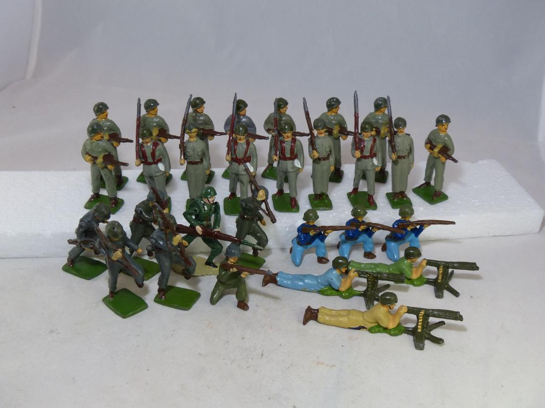 Solidcast Nation Post War 32 Figures 55mm: Made by Asturias in Mexico. Mixture of uniforms. Gray uniform with green pot helmet. Dark gray with matching pot helmet. Few blue also with pot helmet. No rifles broken and most have movable arms. Pai
