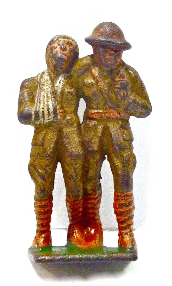 Grey Iron Rare Soldier Walking with Wounded: About 85% paint remaining. Nothing broken and all original. Pre War and one of the toughest Grey Iron piece to find. 1 Piece. Prewar with Orange Leggings. Good to Very Good.