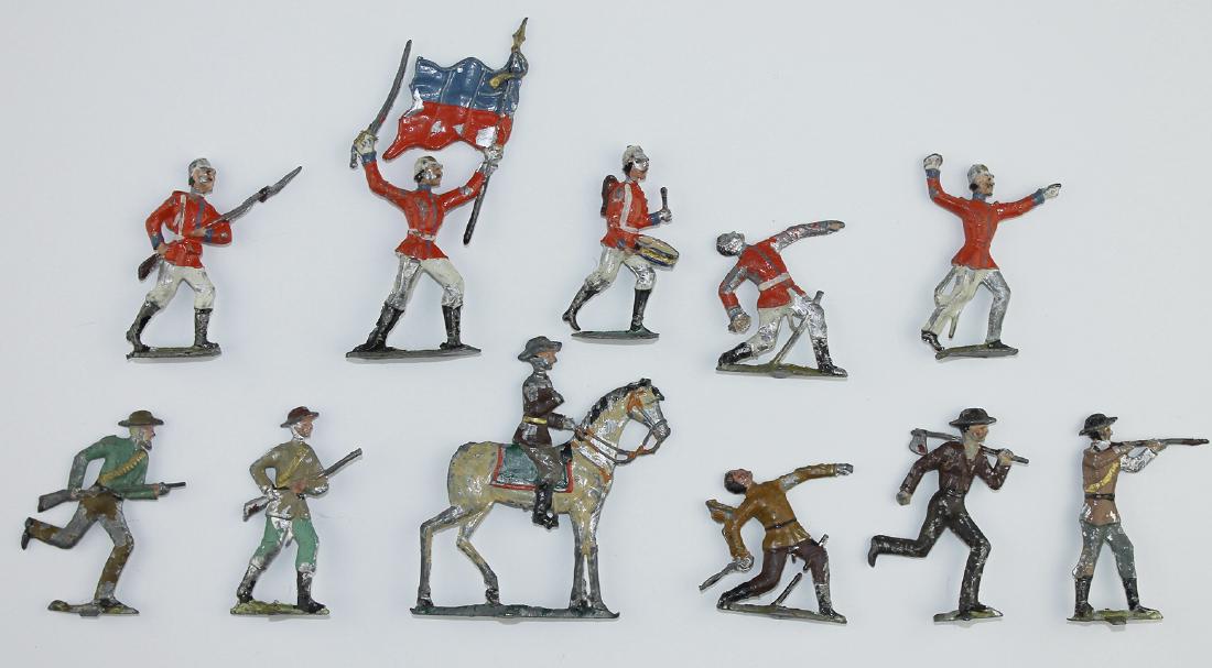 55mm Demi-Round Boers Bulgarians: 55mm lead demi-round figures including a group of Boers with mounted officer, and a group of Bulgarians including flagbearer. Circa 1900. Condition: good with paint wear. Boer officer missing sword ha