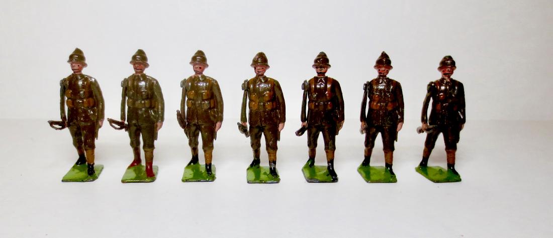 Britains from Set #110 Devonshire at the Trail: 7 pieces. Pre War Very good condition. 1 broken rifle. 1 mismatched boot color.