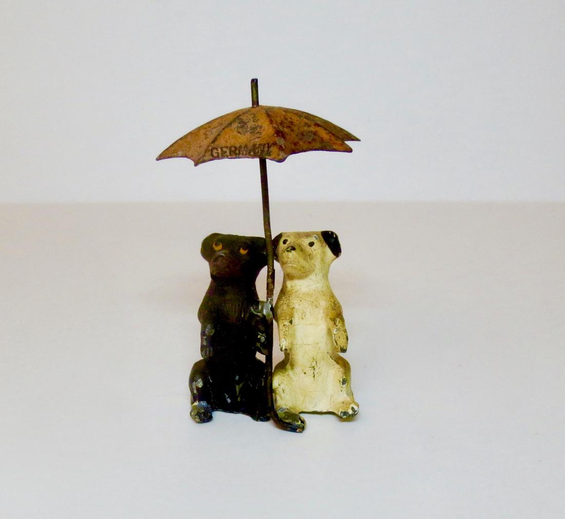 Heyde Dogs with Umbrella: 1 piece. Very good condition. No box.
