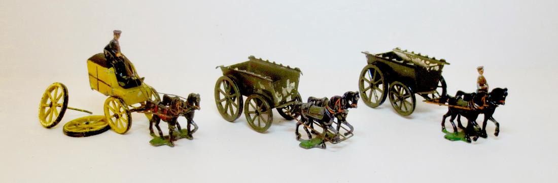 Heyde Carriage & Supply Wagons: 11 pieces. 30 mm scale. Fair condition. Back wheels broken off of carriage. Loose wheels on supply wagon with mounted soldier. Paint loss on all pieces. No box.