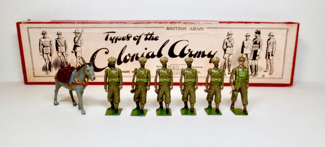 Britains Set #1853 Indian Army Service Corps.: 7 pieces. First version in Types of the Colonial Army box circa 1940. Very good condition (one rifle tip missing). Box very good with some general surface wear.