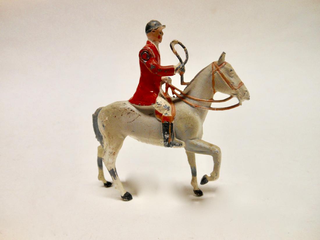 Britains Huntsman on Rare White Horse: Post War. 1 piece. Condition is very good.