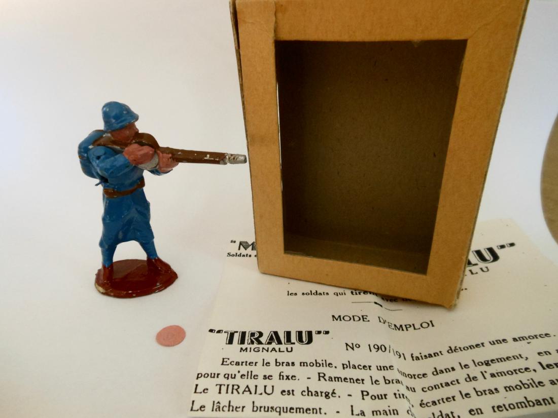 Tiralu Aluminum VERY RARE France Poilu Firing: Has working rifle complete with noise making cap and firing mechanism, with original window box. Instruction leaflet and one unused cap.