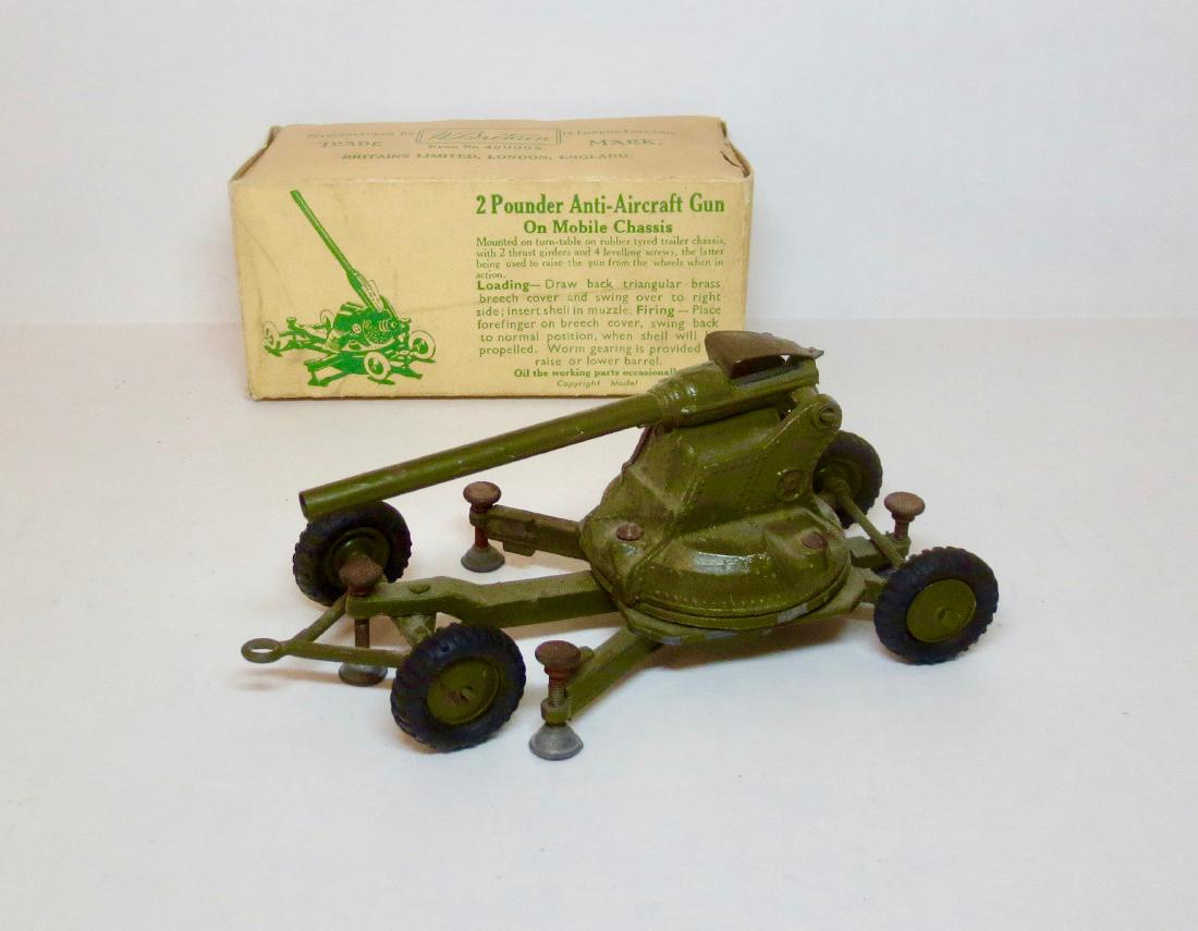 Britains #1717 2 Pounder A.A. Gun on Chassis: 1 piece. Post War. Good condition with some paint wear. Box good with some dents.