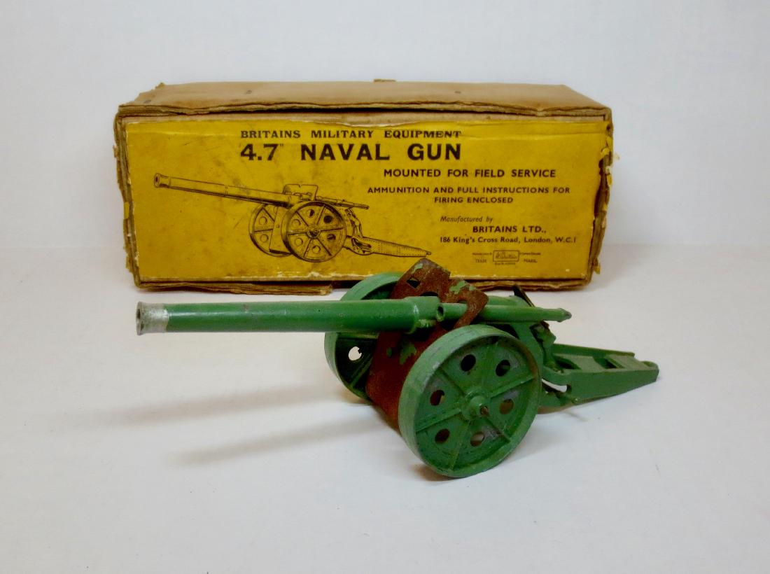 Britains #9730 4.7Inch Naval Gun: 1 piece. Unusual paint color. In Printed Corrugated Box with 1947 gun. Fair condition with paint loss and rust. Box very good.