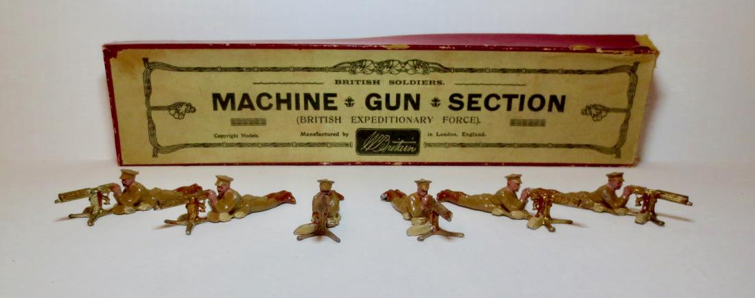 Britains Set #194 Machine Gun Section: 6 pieces. Pre-war. Very good to fair condition with some paint loss and 1 leg missing from gun. Box good (with some surface wear, top corner split and tear on one top side).
