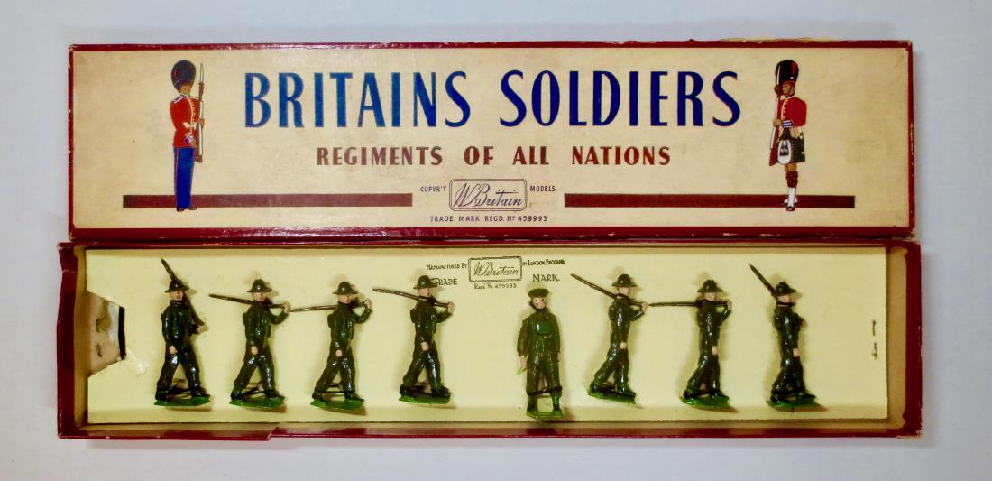 Britains Set #2031 Australians in Battle Dress: 8 pieces. Post War. Excellent condition, tied in R.O.A.N. box. Box fair with tears along top and bottom sides.