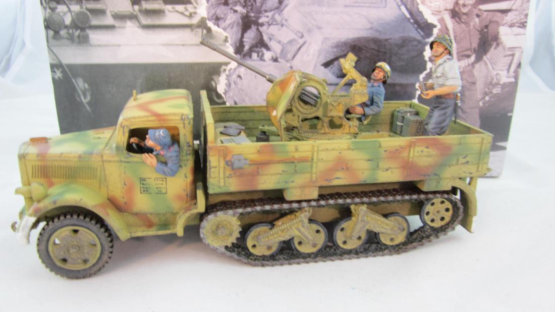 King & Country #LW032 Opel Maultier Flakwagen: Opel Maultier Flakwagen with 37mm Flak gun & 3 crew. 4 pieces. Condition mint in excellent box.