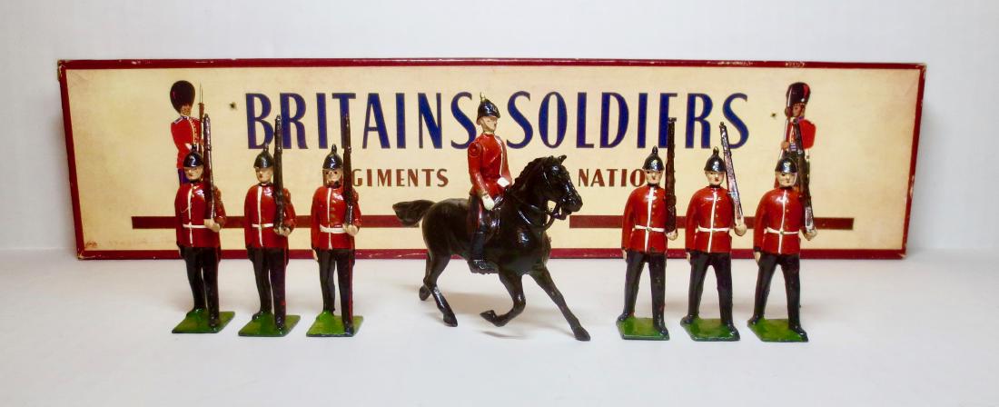 Britains Set #36 The Royal Sussex Regt.: 7 pieces. Post-war in ROAN box. Very good condition, with mismatched bases. Box good, with two small puncture holes on the top.