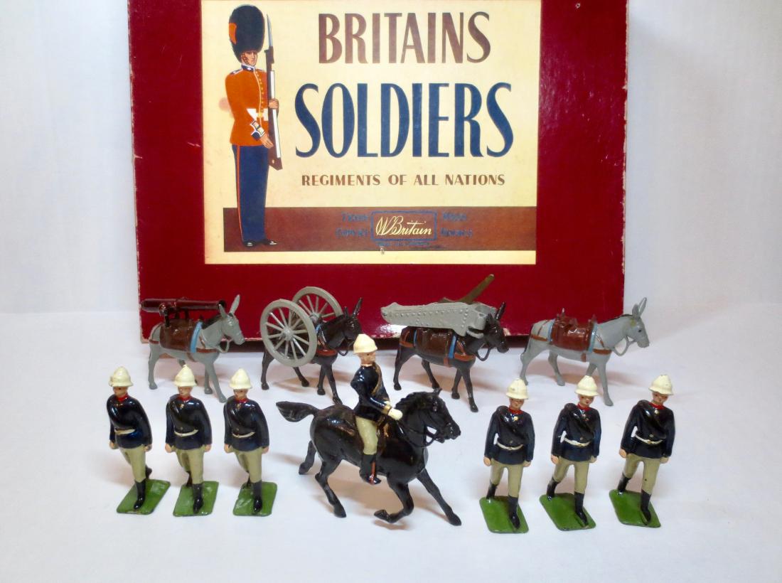 Britains Set #9420 Royal Mountain Artillery: Gun & Detachment. 14 pieces. Post-war in ROAN box. Excellent condition. Box good, with general surface wear and three small puncture holes on the top.