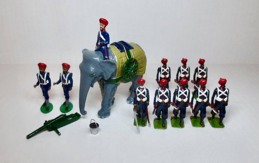 Trophy War Elephant Assortment: 14 pieces. Including Elephant, Mahout, Handlers and Unknown maker Rifle Brigade. Very good condition. No box.