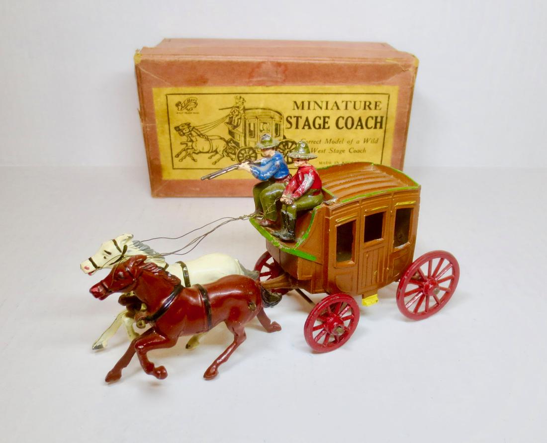 Johillco Stage Coach Set: 5 pieces. Very good condition, with some paint loss. Box very good with some general surface wear and small tears on the top sides.