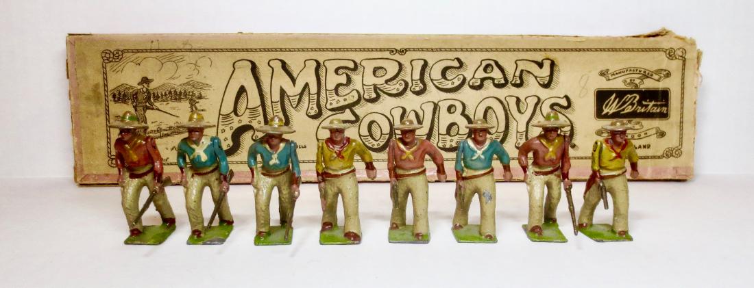 Britains Set #133 American Cowboys: 8 pieces. Rare Pre-war set in Whisstock box. Very good to fair condition, with some paint loss and one broken rifle butt. Box fair with top and bottom corner splits, and one end of top torn.