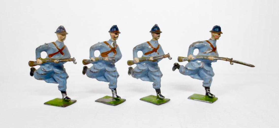 Britains Paris Office French Poilus Charging: 4 pieces. Circa 1919. Unique casting, only used in the Paris Office. Very good to fair, with paint loss, 1 broken rifle and 2 missing bayonets. Unboxed.
