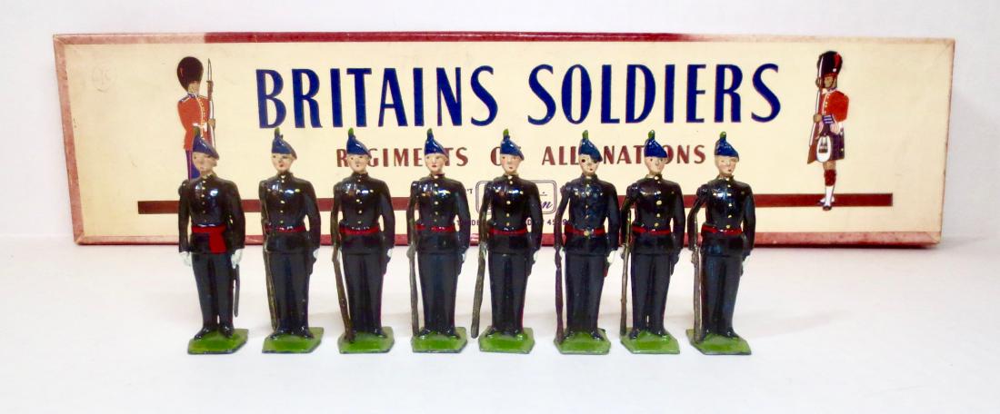 Britains Set #2090 Royal Irish Fusiliers: 8 pieces. Post-war in ROAN box. Excellent condition. Box poor, with faded top and water damaged bottom.