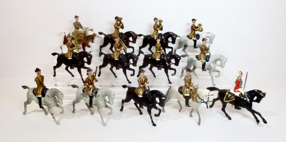 Britains Set #101 Band of the Life Guards: 13 pieces. Post War. Excellent to very good condition, with some paint loss, tuba player missing arms and damage to one trombone player's arm. Post-war. Unboxed.