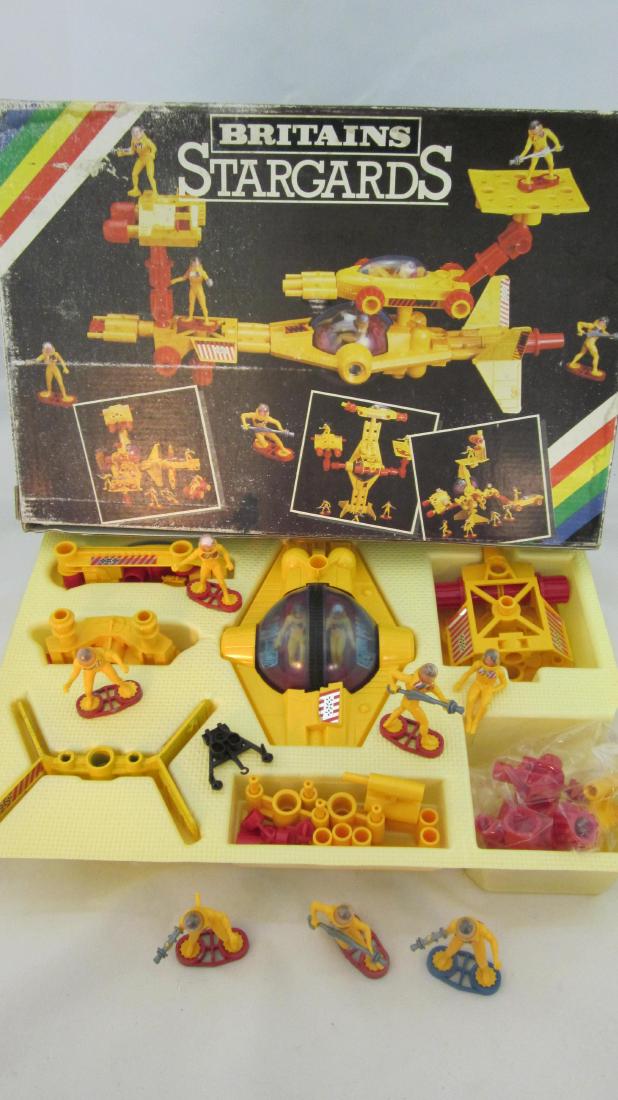Britains #9147 Plastic Stargards.: SpaceGuards with space vehicles. 14 pieces. Condition excellent, (2 missing their right hand weapons) in fair box with insert. Circa 1982.