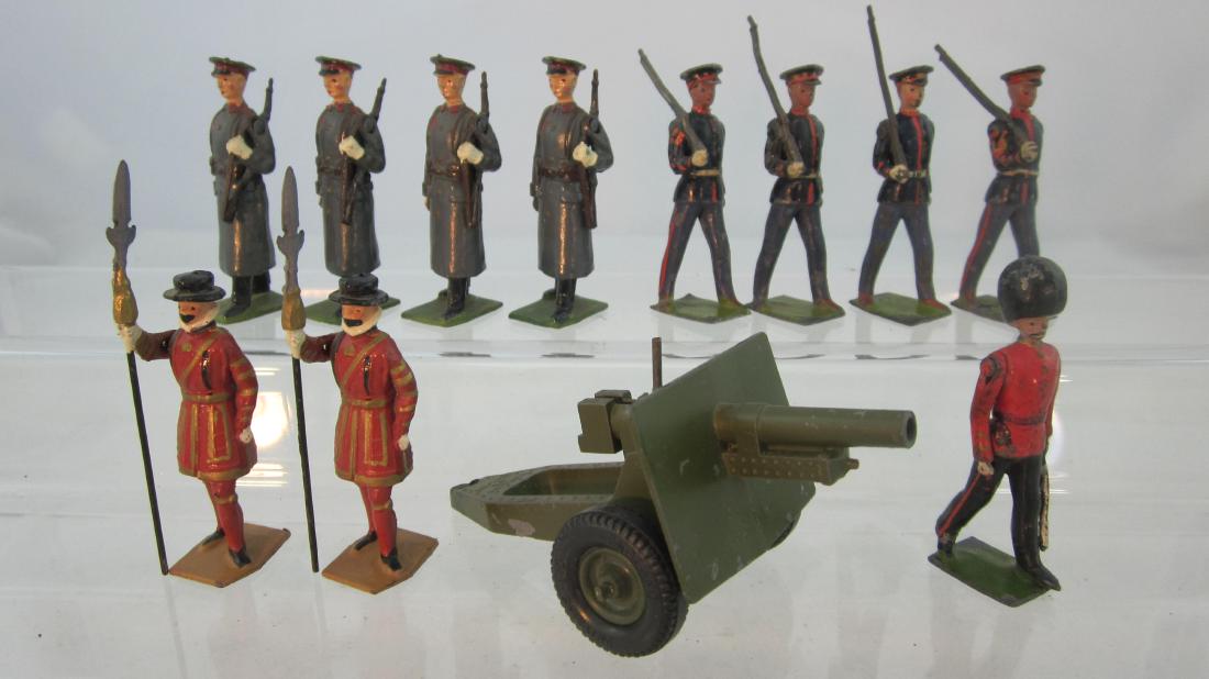Britains Assorted Troops & Gun.: #2025 25 Pounder Howitzer, #2028 Soviets, #1555 Guards officer, & #228 prewar U.S. Marines. 12 pieces. Condition very good.