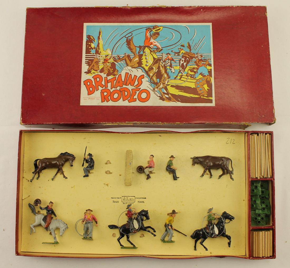 Britains Set #2043 Britains Rodeo: Large Post War set includes 3 mounted cowboys, 2 foot cowboys, 3 seated figures (seated cowboy with pistol missing), bench and components to make a stockade. Made 1950-59 Only. 27 pieces. Condition ve