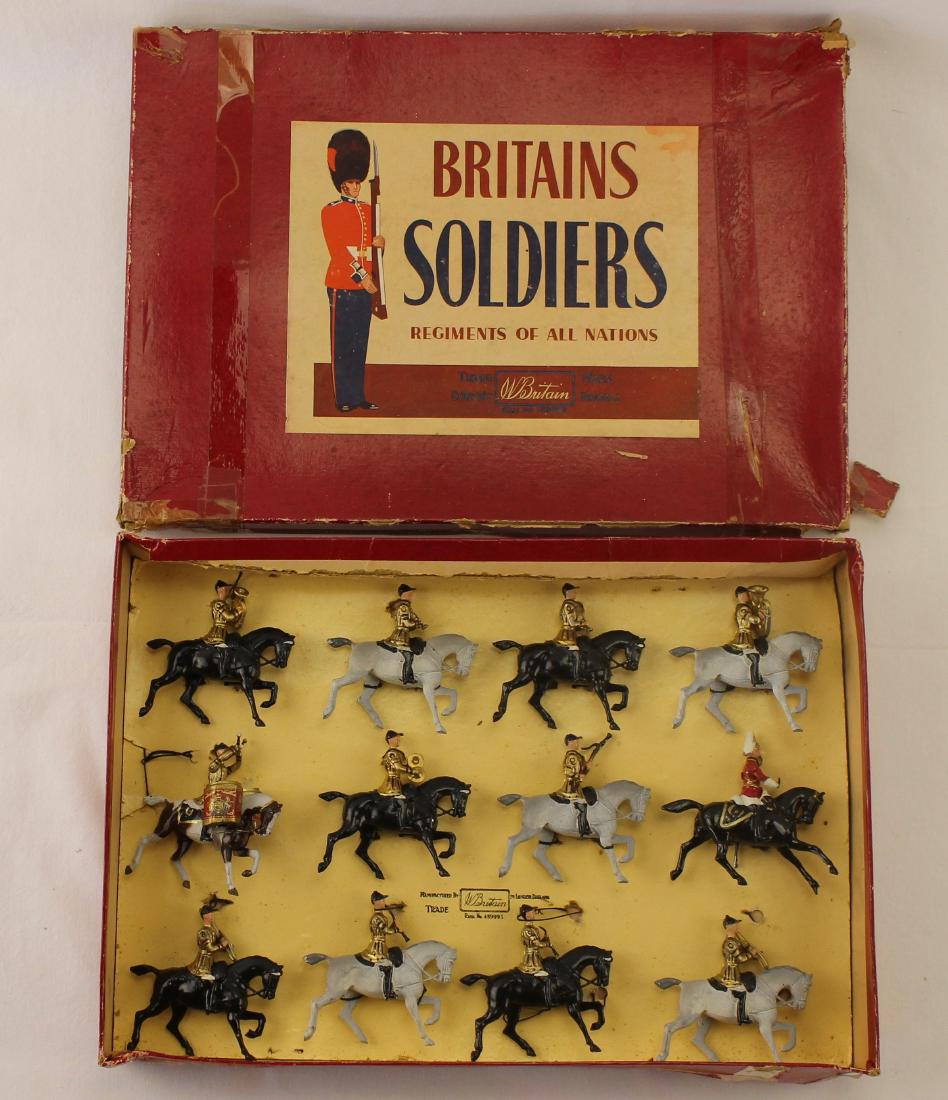 Britains Set #101 Band of the Life Guards: Post War set. 12 pieces. Condition excellent still tied to card. ROAN box fair to poor, crushed with old sticky tape applied. Some split corners to lid.