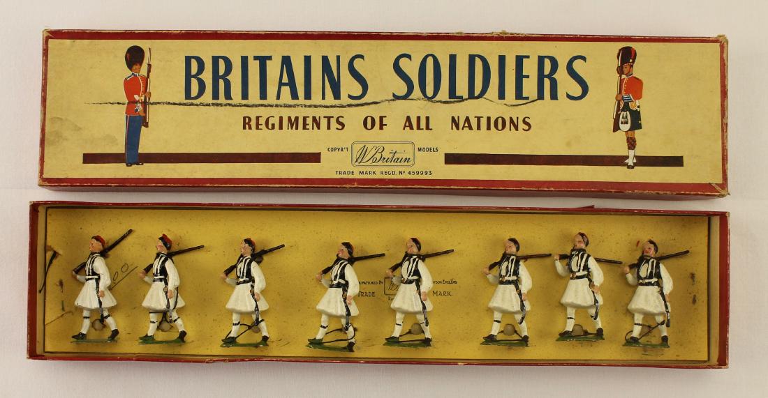 Britains Set #196 Greek Evzones: Post War set. 8 pieces. Condition very good to excellent - still tied to card. Rifles bent. ROAN Box fair to good with grease pen line on label.
