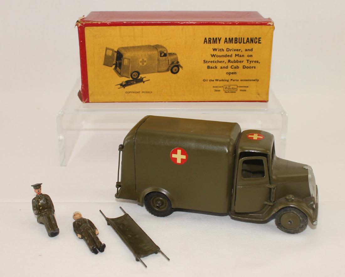 Britains Set #1512 Army Ambulance: Post War. Includes driver, wounded and stretcher. 4 pieces. Condition good to very good. Box very good.