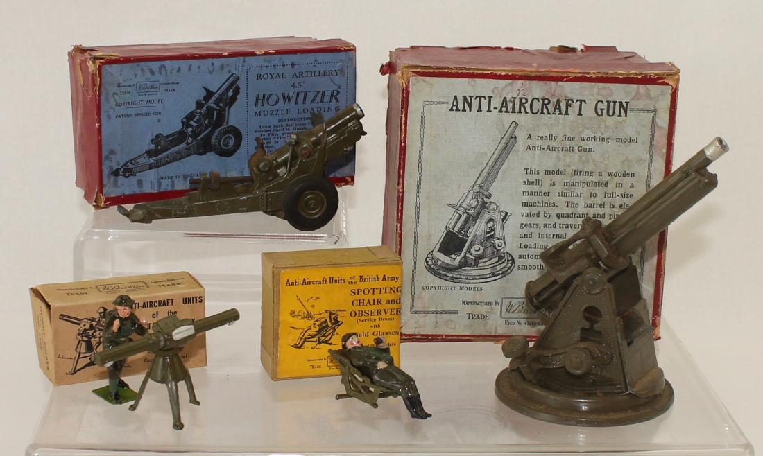 Britains Lot Set #1522 Anti Aircraft Gun: Pre War lot includes Set #1522 Anti Aircraft Gun in box, Set #1725 4.5" Howitzer Gun in Box, Set #1729 Height Finder in Box, and Set #1731 Spotting Chair with Observer with box. 7 pieces. Condition fa
