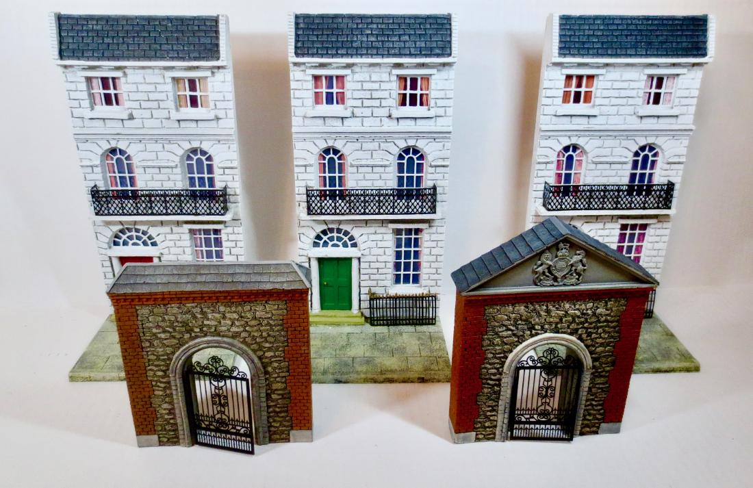 Maker Unknown Resin Building Facades: 5 pieces. Tallest buildings measure about 12" tall. Excellent to very good condition (one white building loose from it's base). Unboxed.