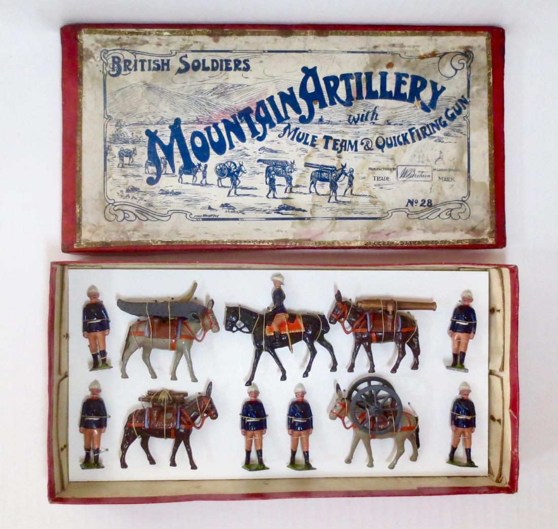 Britains 28 Mountain Artillery with Mule Team: And Quick Firing Gun. Pre war with original Whisstock box. 15 pieces. Excellent condition. Box very good with some surface wear and side tear neatly repaired. Figures tied to a new card in box.