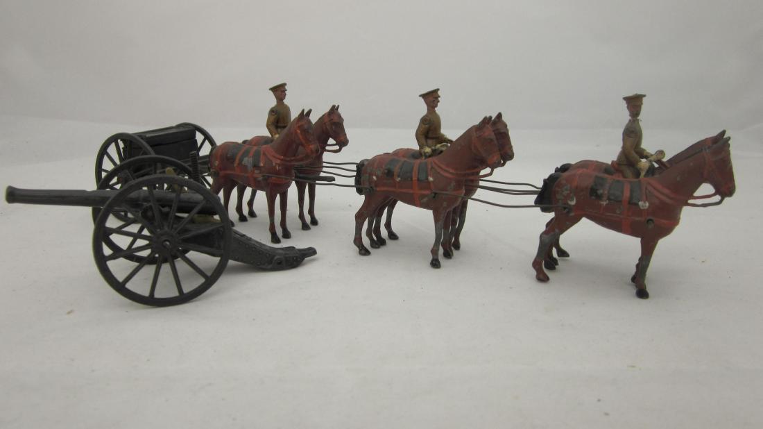 From Britains Set #318 Horse Artillery at Halt: Royal Horse Artillery, Service Dress, at HALT, rare standing horses, breast harness with early gun & caisson. 8 pieces (no standing nor kneeling gunners, but see next lot). Condition very good, cannon