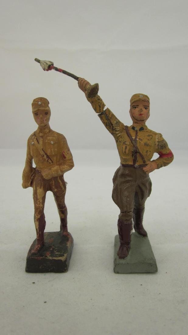 Lineol Brownshirts Marching: German Brownshirt marching with Drum Major. 2 pieces. Condition very good, some paint loss, drum major crack in arm & swastika armbands scratched out.