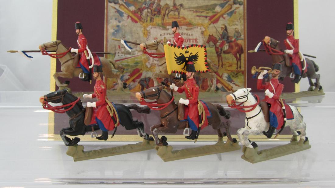 Lucotte Napoleonic Cossacks Charging: Lucotte Russian Cossacks in red coats on charging horses. 6 pieces issued circa 1995. Condition excellent in excellent box.
