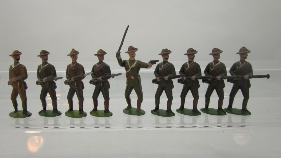 Britains Set #104 City Imperial Volunteers: Boer War period City Imperial Volunteers circa 1920s. 8 pieces including officer with sword & pistol. 9 pieces. Condition very good, 4 bayonet missing, 1 lighter shade to uniform, mismatched set.