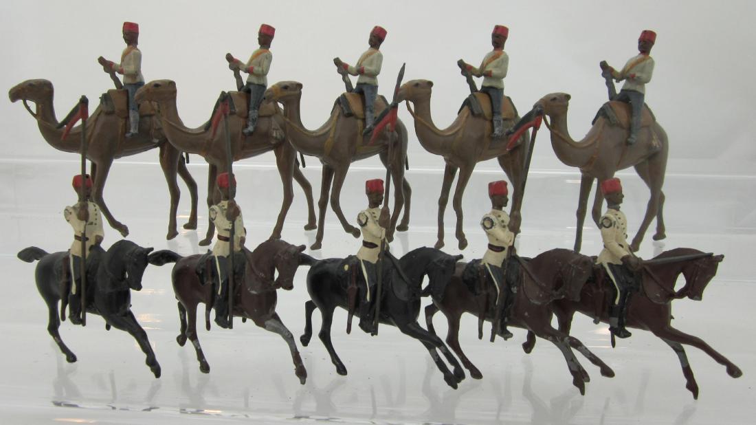 Britains Egyptian Cavalry & Camel Corp Camels: Set 115 Egyptian Cavalry Set with officer, with Camel Corp 5 men & camels. 15 pieces. Condition good, 4 lance tips, 5 rifle barrels, & 2 hooves gone.