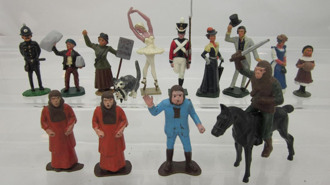 Various Maker Edwardian People: Tradition's Soldier & Ballerina, Under 2 Flags Gent Wooing Damsel, & others, along with 4 plastic planet of the Apes figures. 14 pieces. Condition excellent.