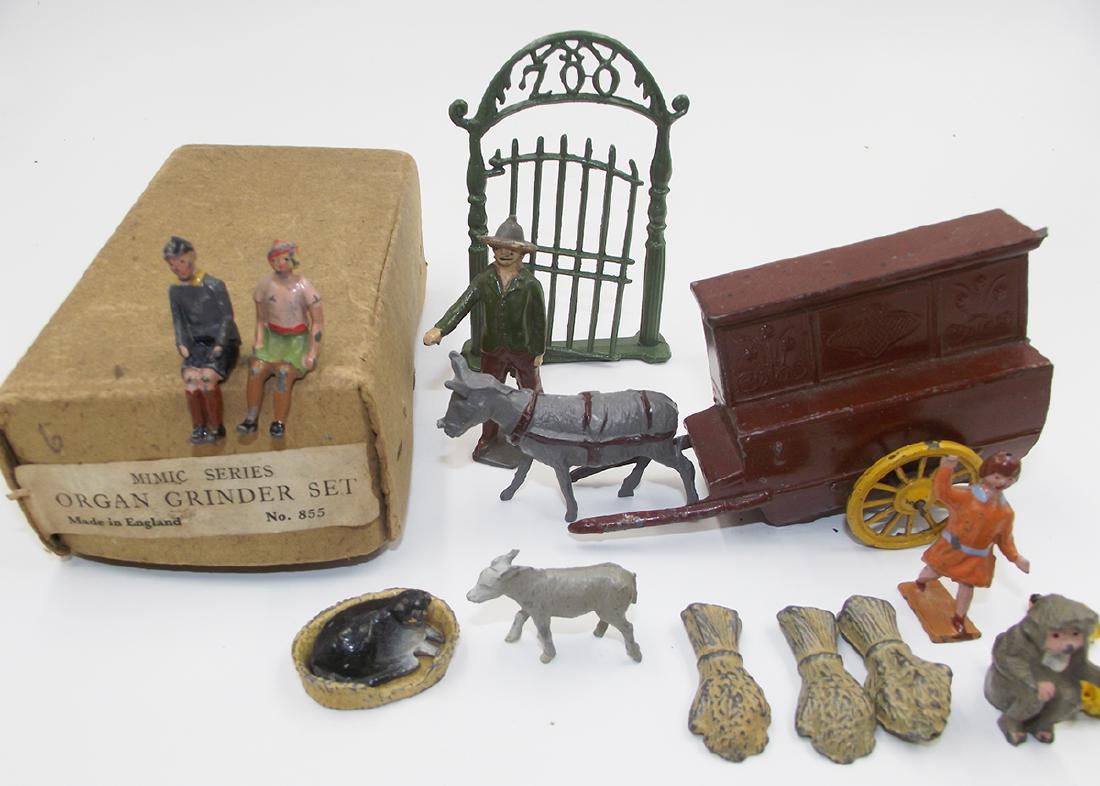 Taylor & Barret Charbens and Others: 15 pieces, good to very good condition. Taylor and Barret Organ Grinder Donkey Set is excellent. Box is good. One pin is broken on the zoo fence. Nice group of scarce accessories.
