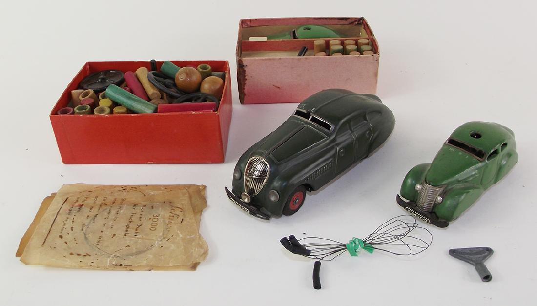 Schuco Group of Cars and Parts: Two cars and some associated boxed items and paperwork. Good to very good condition.